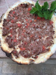 fatayer bi lahme on plate with mint
