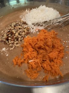 CARROT CAKE BATTER ADDING CARROTS COCONUT NUTS