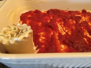 LASAGNA NOODLES ROLLED OVER SAUCE